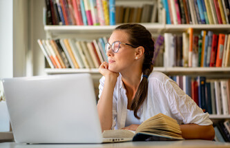 a woman at a library looking out 